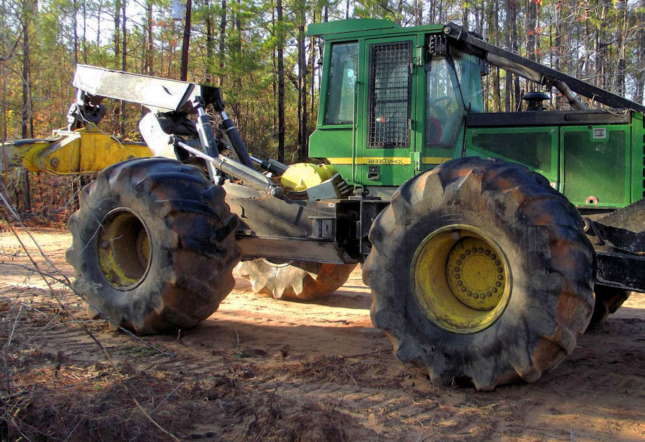 john deere skidder working in the woods